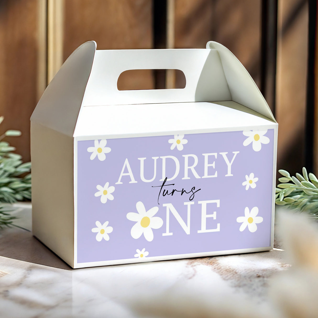 Personalised gable favour box in purple with white daisies, cut-out handle, Audrey turns One.