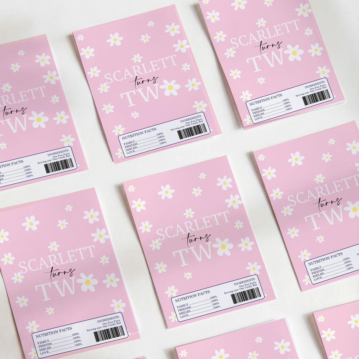 Pink DIY chocolate wrappers with daisy print and SCARLET TW text, barcode labels.