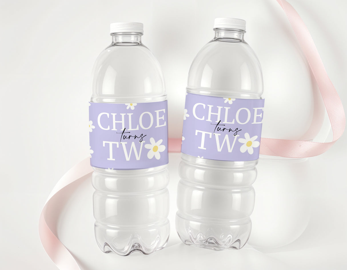 Purple daisy personalised water bottle labels wrapped around two clear bottles