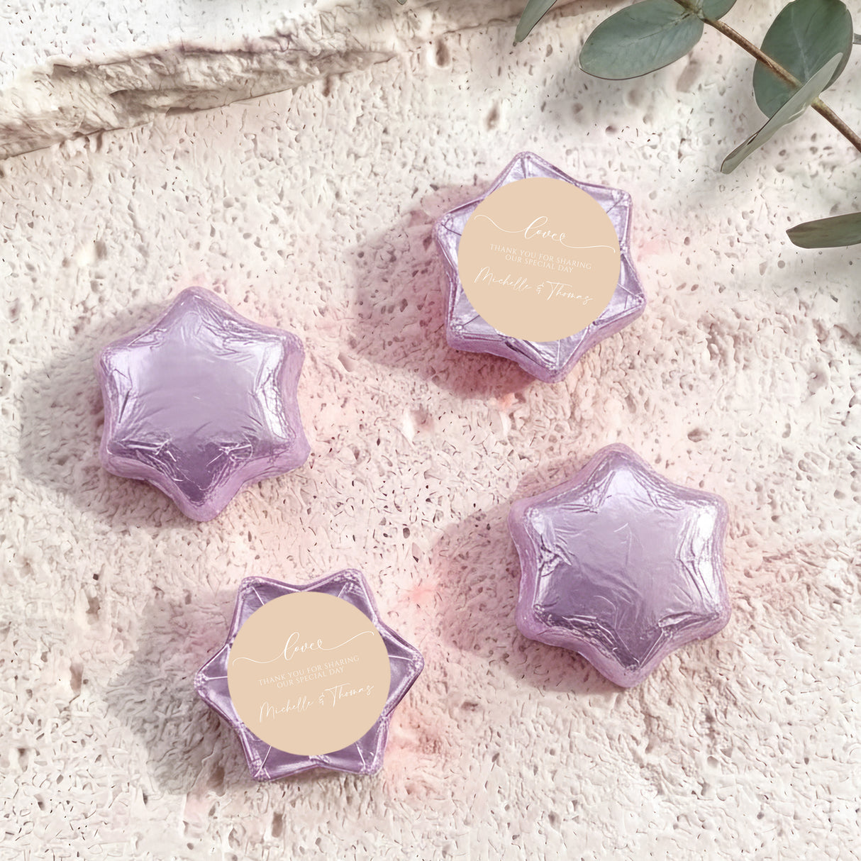 Lavender foil-covered chocolate stars with round name tag toppers