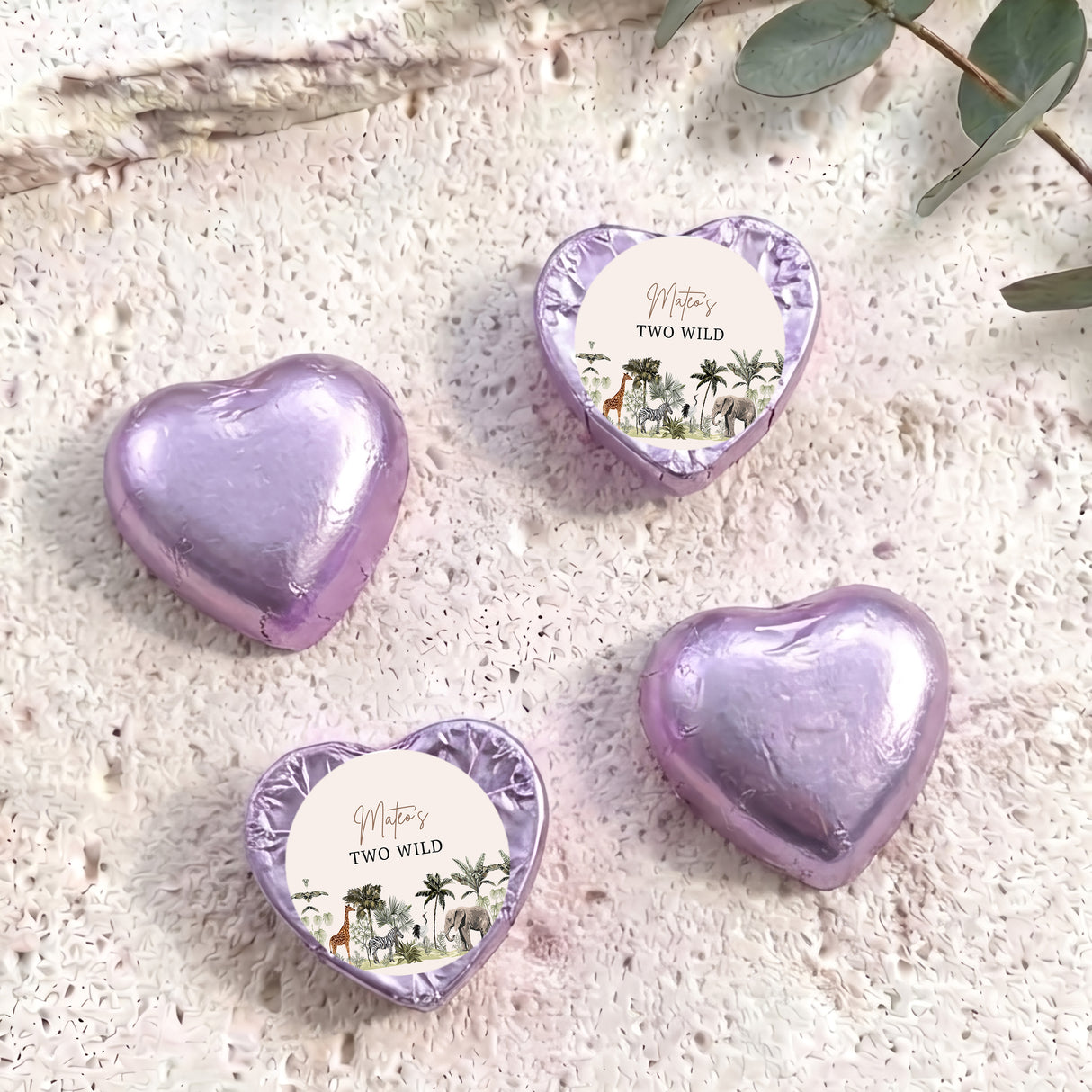 Lilac-purple foil chocolate hearts with “Two Wild” personalised round label