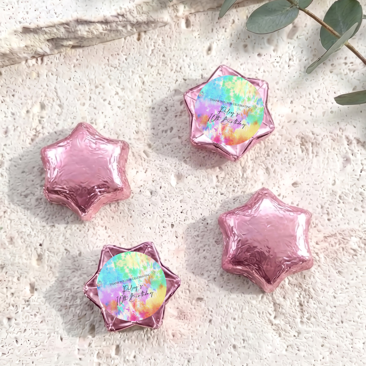 Foil-covered chocolate stars: pink foil stars with one rainbow tie-dye star