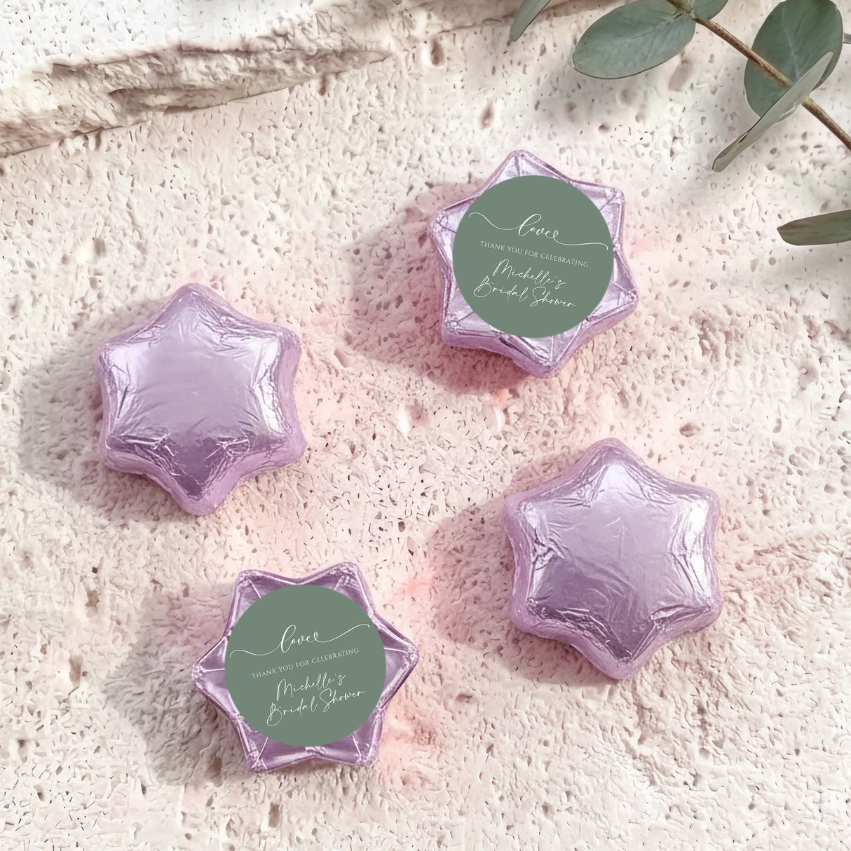 Foil-covered chocolate stars, lilac purple with round personalized label