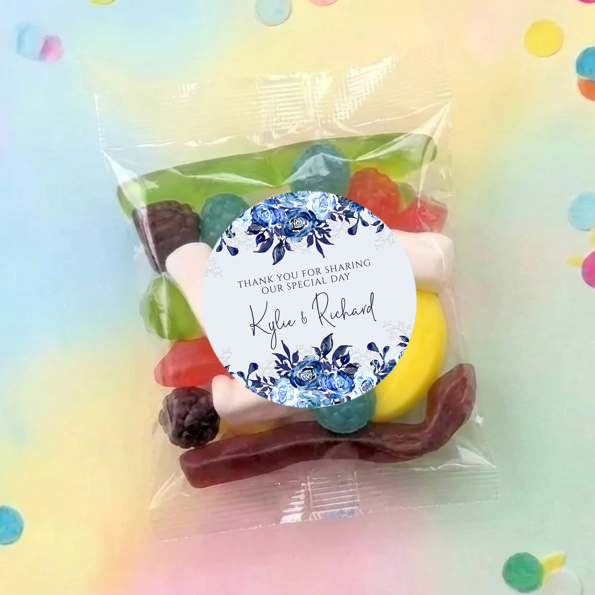Personalised lolly bag with blue floral round label and mixed sweets inside