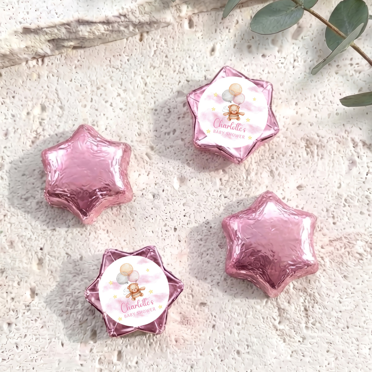 Pink star-shaped foil balloons with 'Charlotte's Baby Shower' teddy design