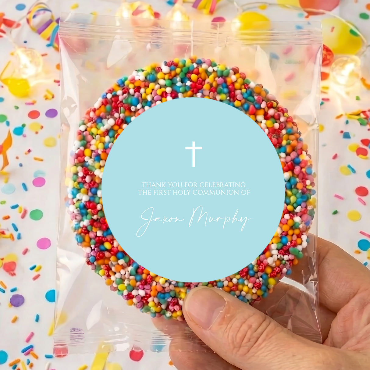 Personalised first communion badge with cross, pastel blue center and rainbow bead border