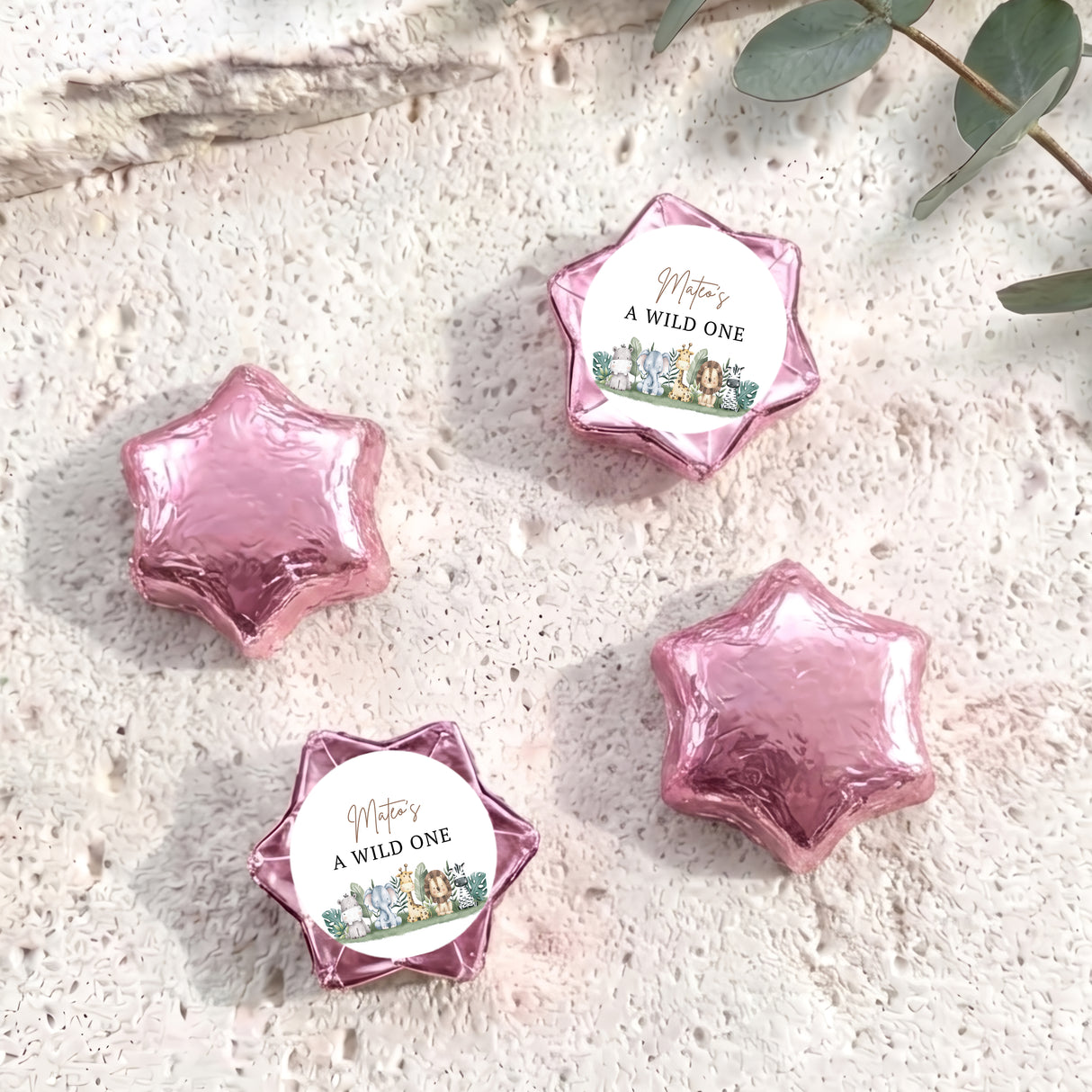 Foil-covered chocolate stars with 'A WILD ONE' labels, pink foil star chocolates