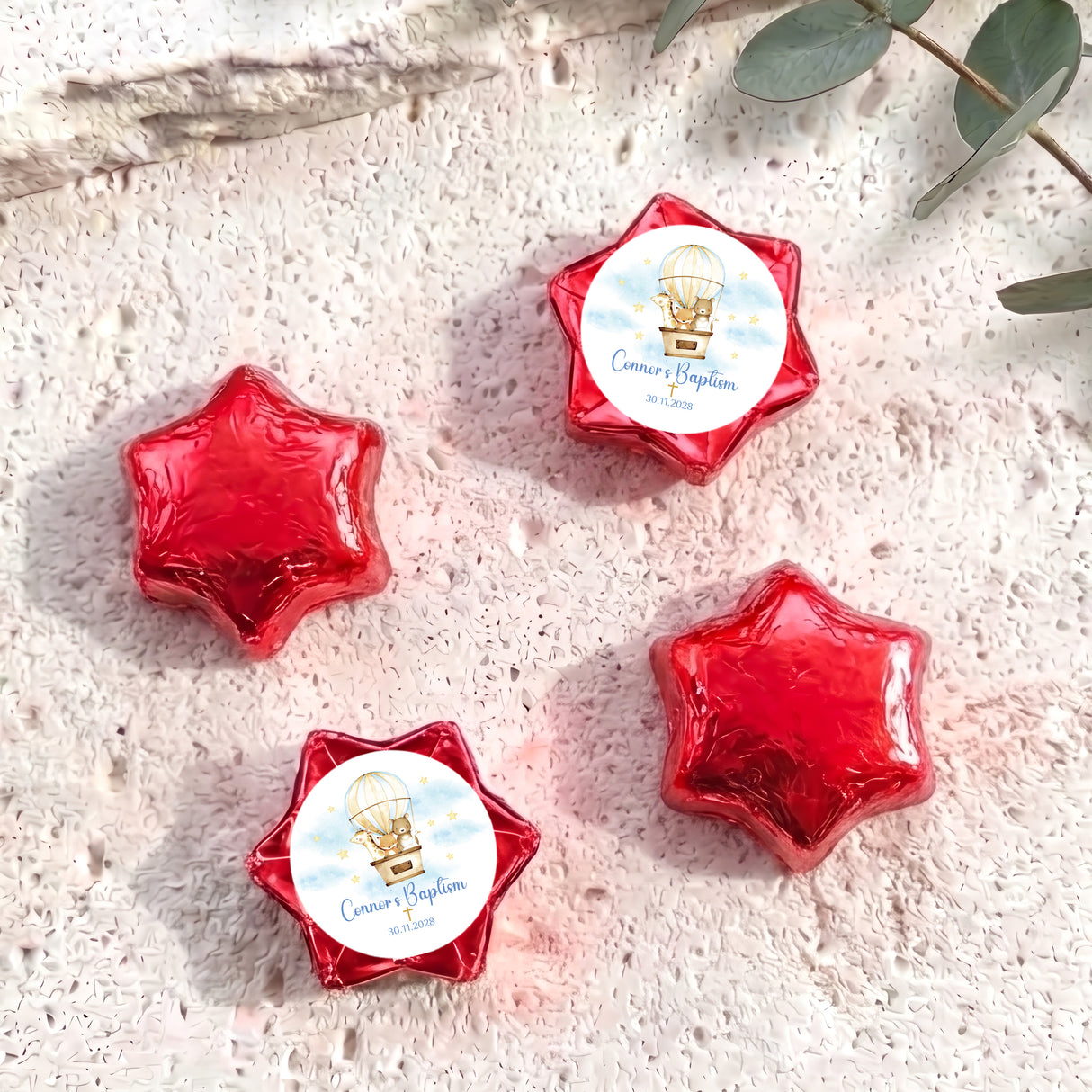 Set of five red star-shaped foil chocolates with baptism label and balloon motif
