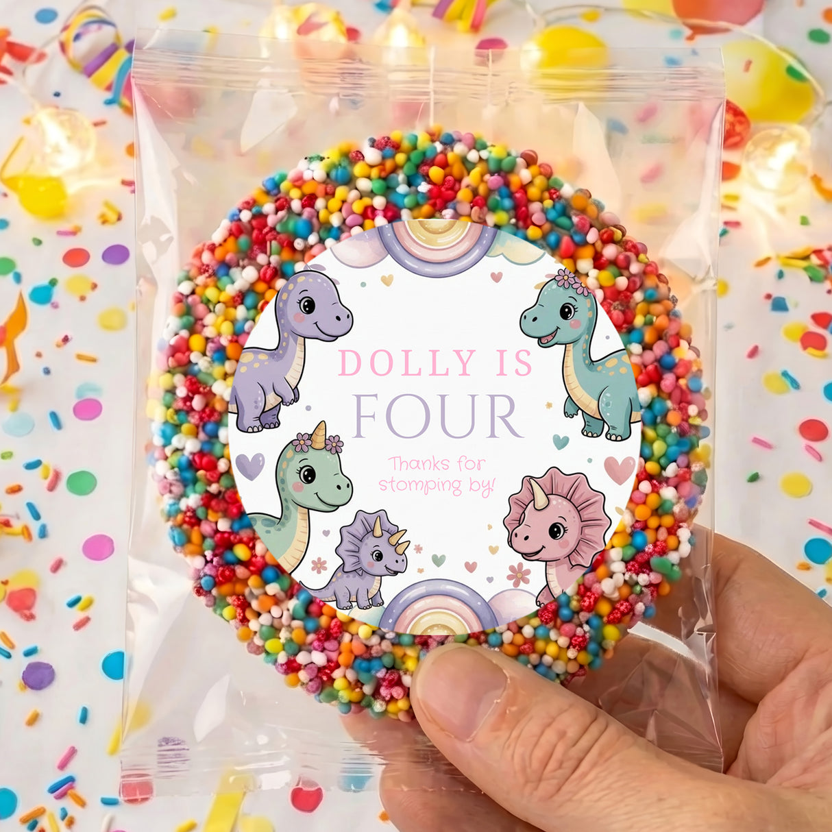 Personalised dinosaur birthday card “Dolly is Four” in clear plastic bag