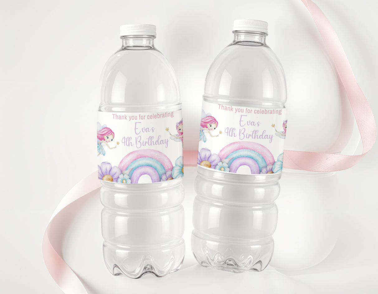 Personalised water bottle labels on two clear bottles with rainbow and fairy design