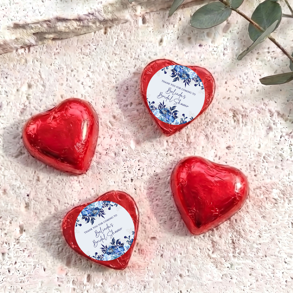 Foil-covered chocolate hearts in red foil with printed thank-you label