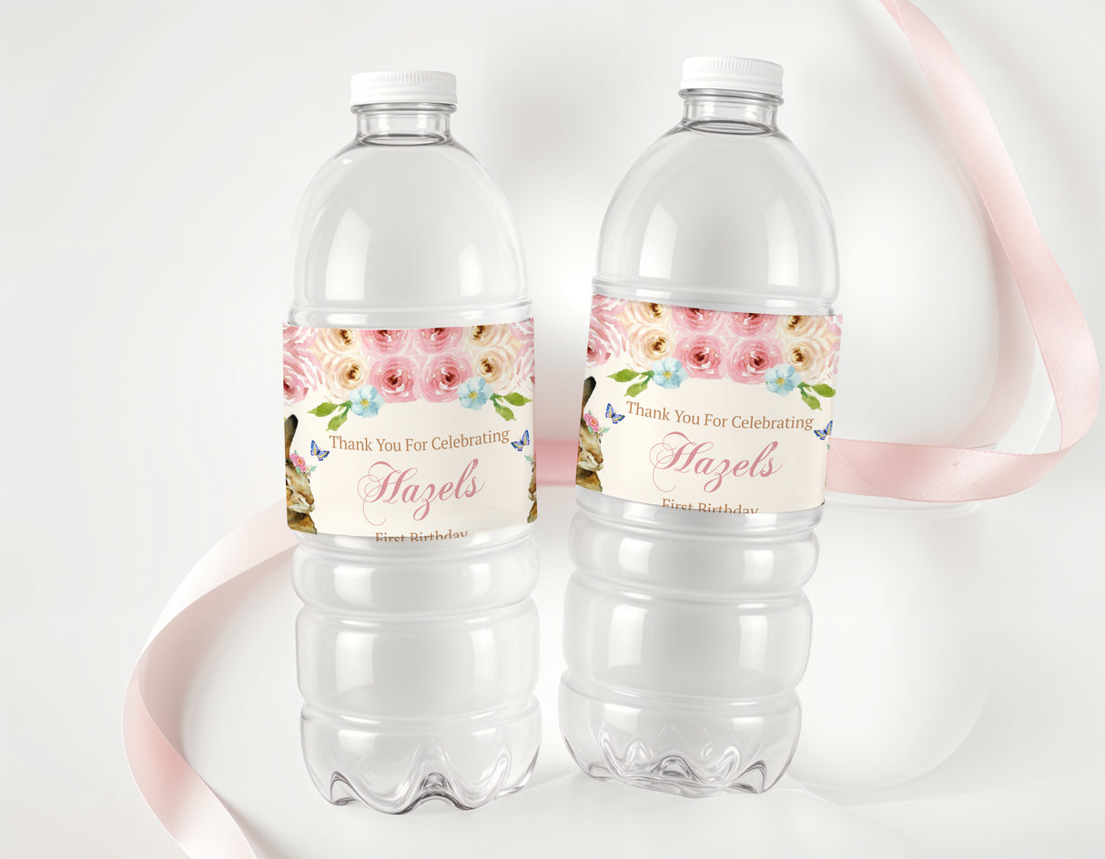 Personalised water bottle labels with floral pink bunny design, wrapped around two bottles