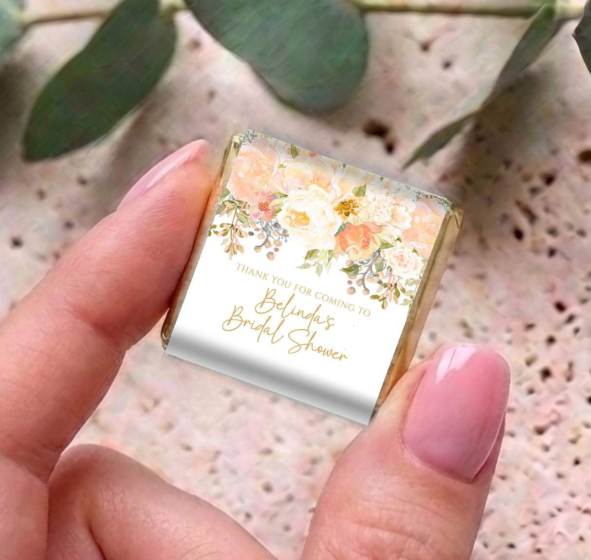 Mini chocolates in silver foil with floral peach rose wrapper and thank-you bridal shower text