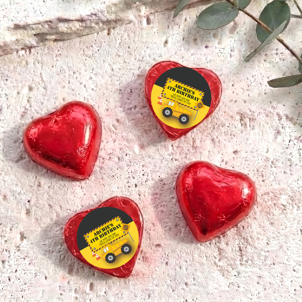 Red foil chocolate heart with 'Archie's 4th Birthday' label