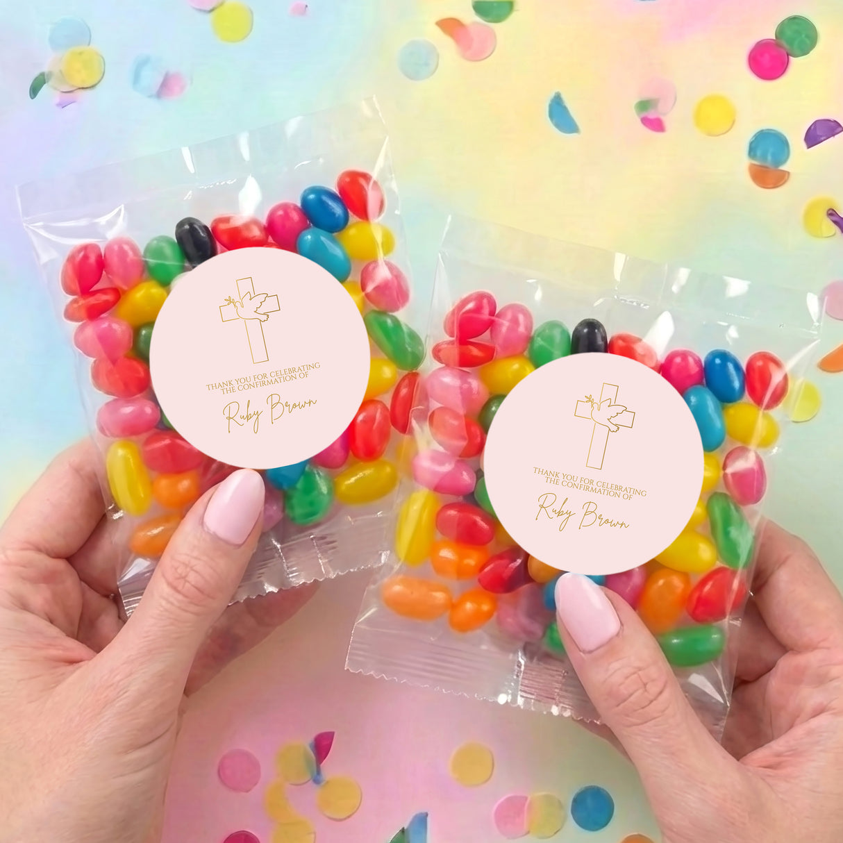 Two personalised confirmation jelly bean bags with round cross labels and colorful candies