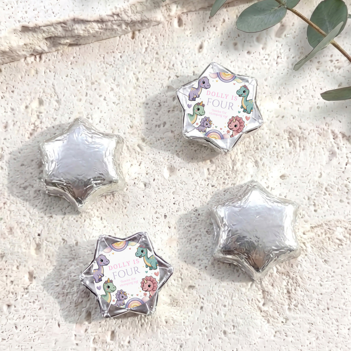 Silver foil star balloons plus white dinosaur “Dolly is Four” foil balloon