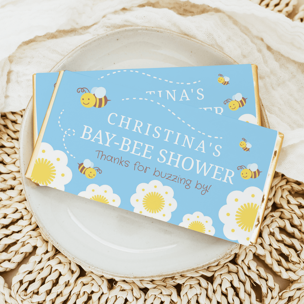 Bee-themed blue chocolate bar wrappers with personalized shower text