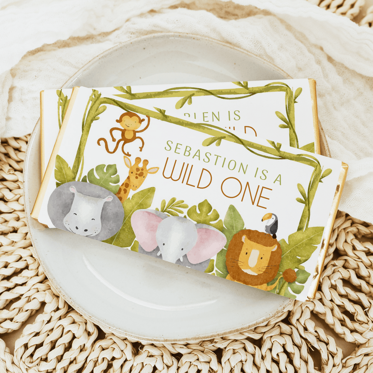Jungle-themed chocolate bars with cartoon animals and “Wild One” birthday message