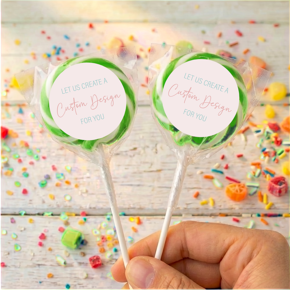 Personalized lollipop pair with green candy swirl, 'Custom Design' label on each stick