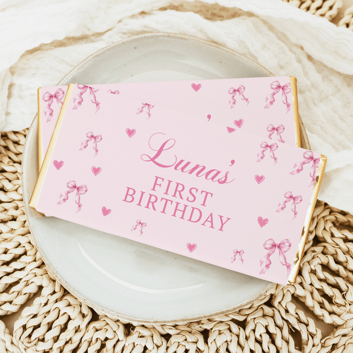 Pink chocolate bar wrapper: Luna's First Birthday with bows and hearts