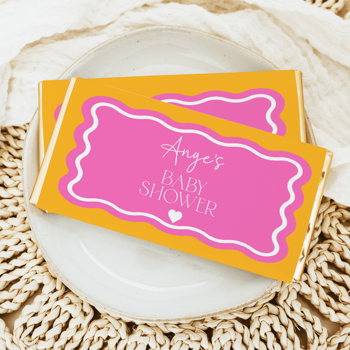 Personalised baby shower chocolate bars, wavy pink and orange wrappers, 'Angie's' text