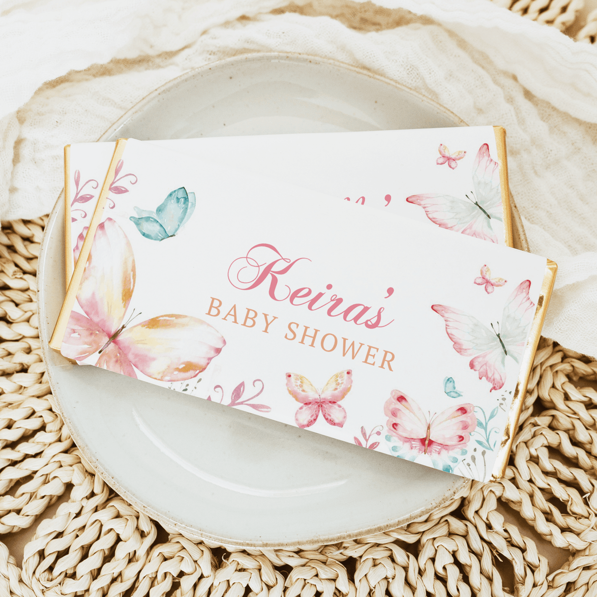 Personalised baby shower chocolate bars with butterfly design and “Hevias” text