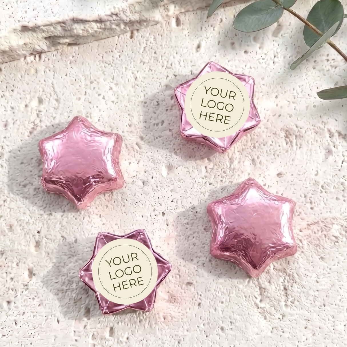 Pink foil-covered chocolate stars with a round “YOUR LOGO HERE” imprint card