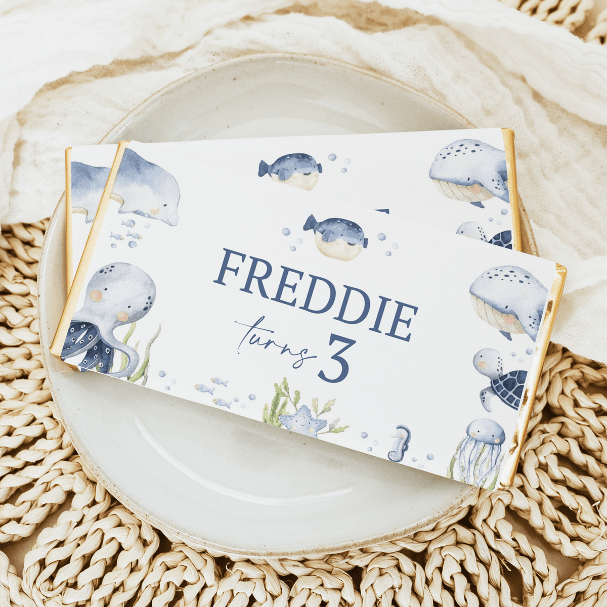Birthday chocolate bar wrapper: whales theme and 'Freddie turning 3'.