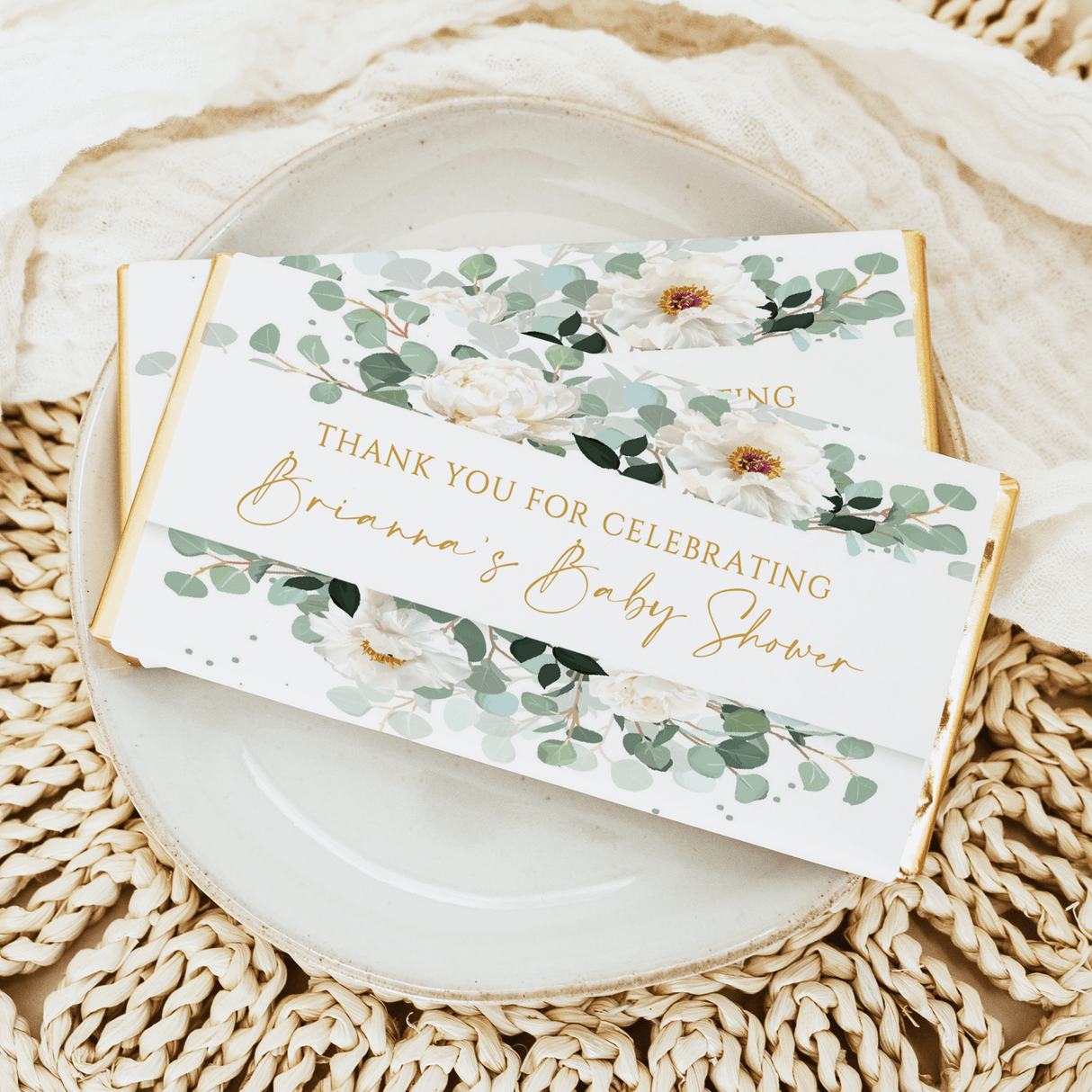 Personalised baby shower chocolate bar wrappers with white flowers and green greenery
