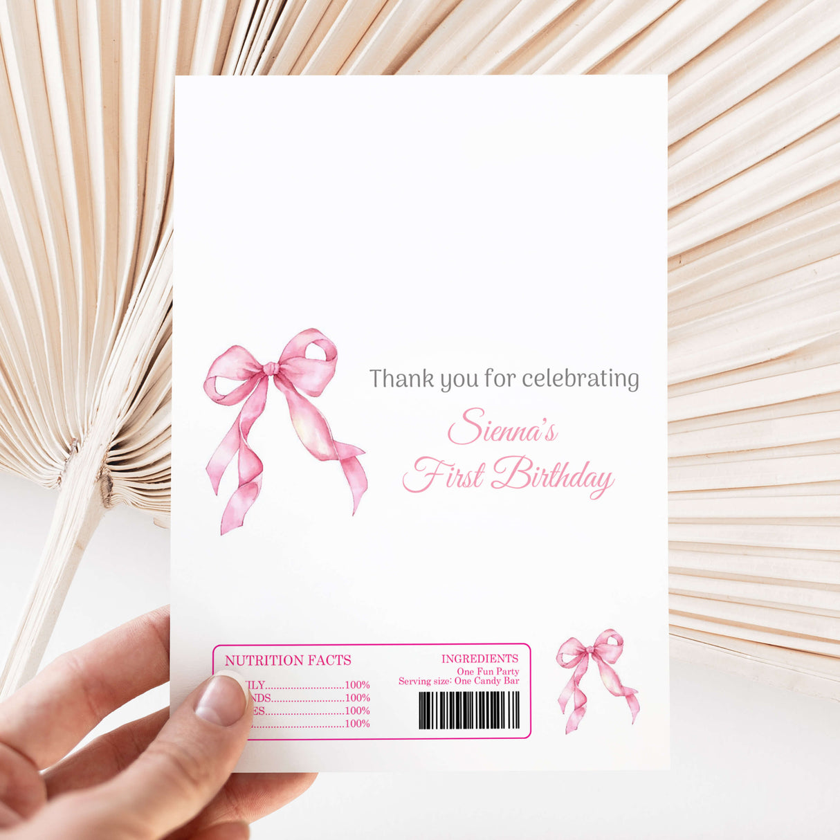 Pink ribbon bow first birthday printed chocolate wrapper with Sienna’s thank-you text