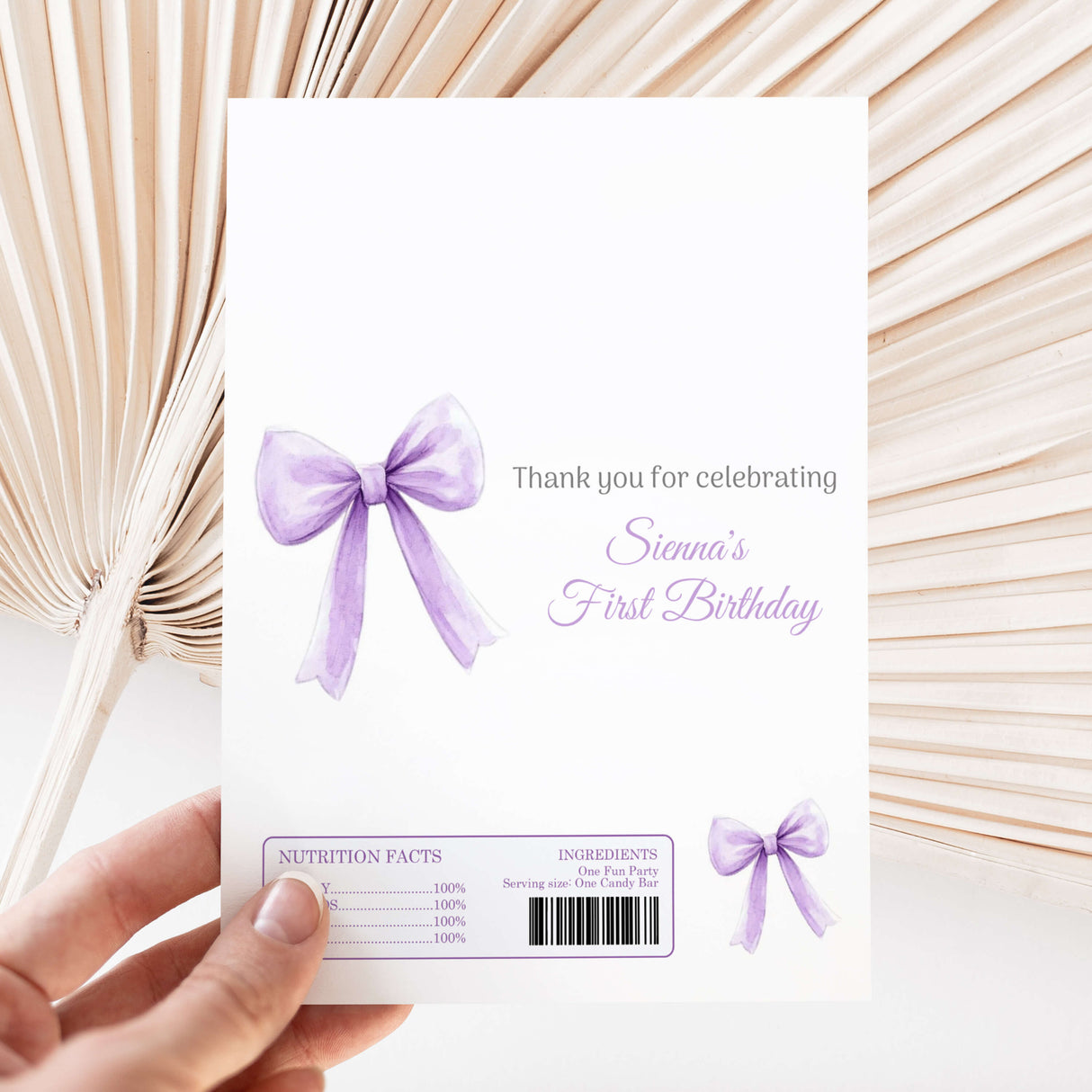 Purple bow printed chocolate wrapper with “Sienna’s First Birthday” text