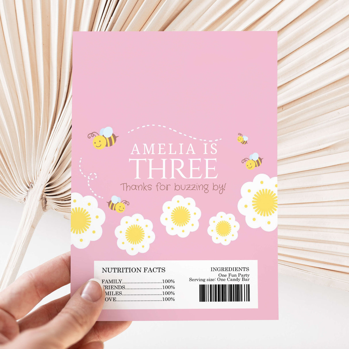 Pink bee-themed DIY chocolate wrapper, 'Amelia is three' and nutrition/ingredient panel