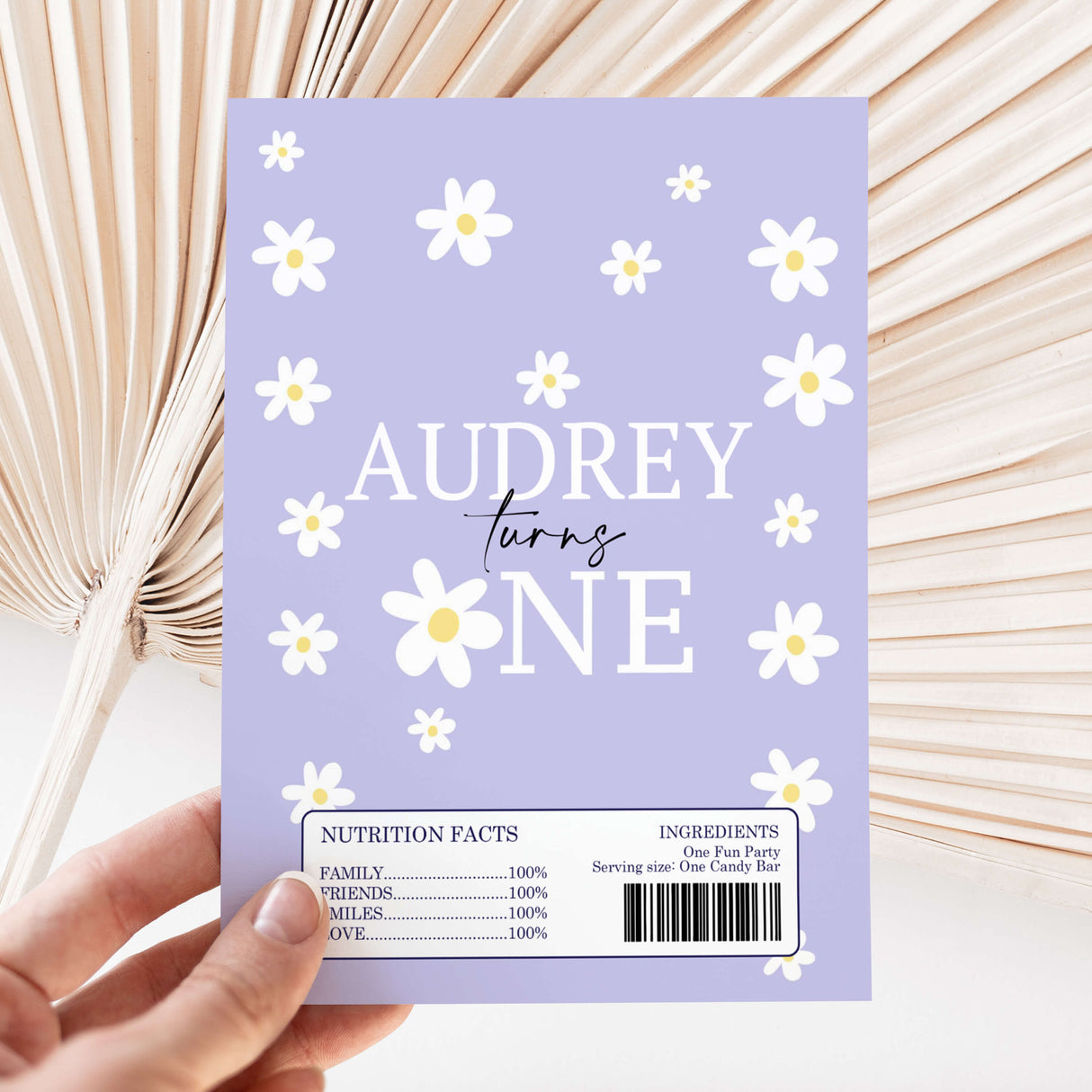 Purple DIY chocolate wrapper with daisies, 'Audrey turns one' text and barcode