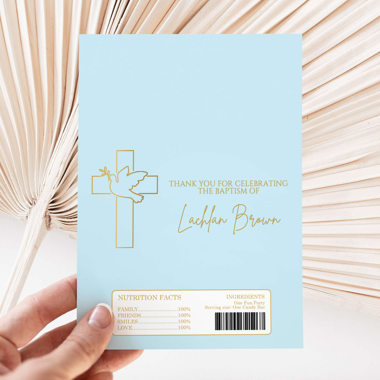 Blue baptism chocolate wrapper with dove cross, thank-you text, and barcode