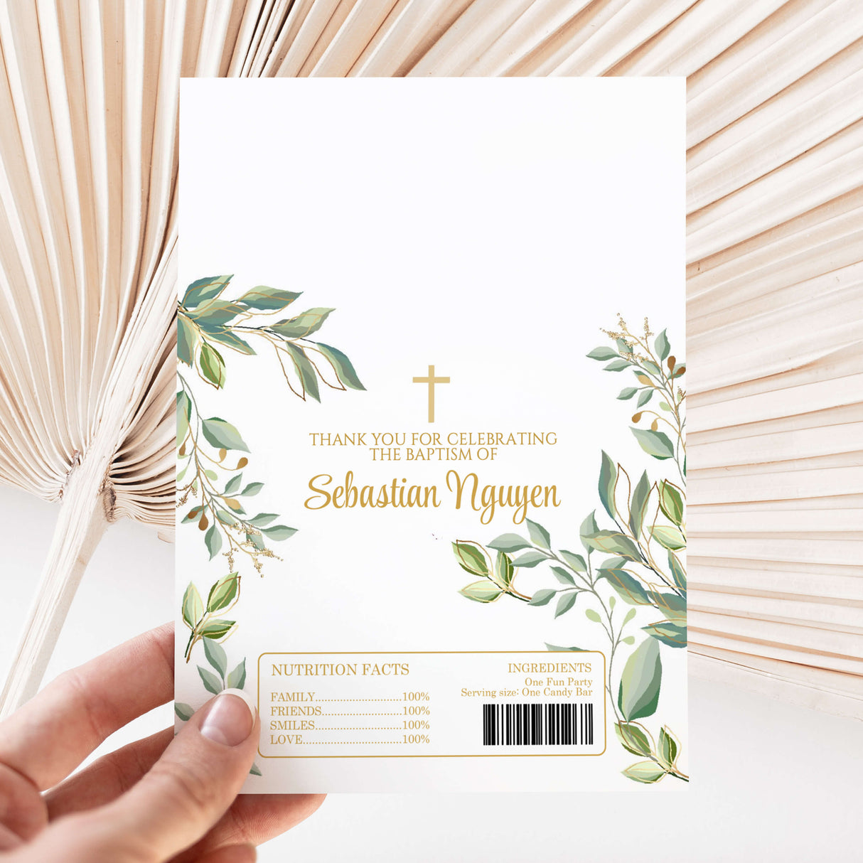Baptism thank-you chocolate wrapper with green leaves, cross, and Sebastian Nyqgen