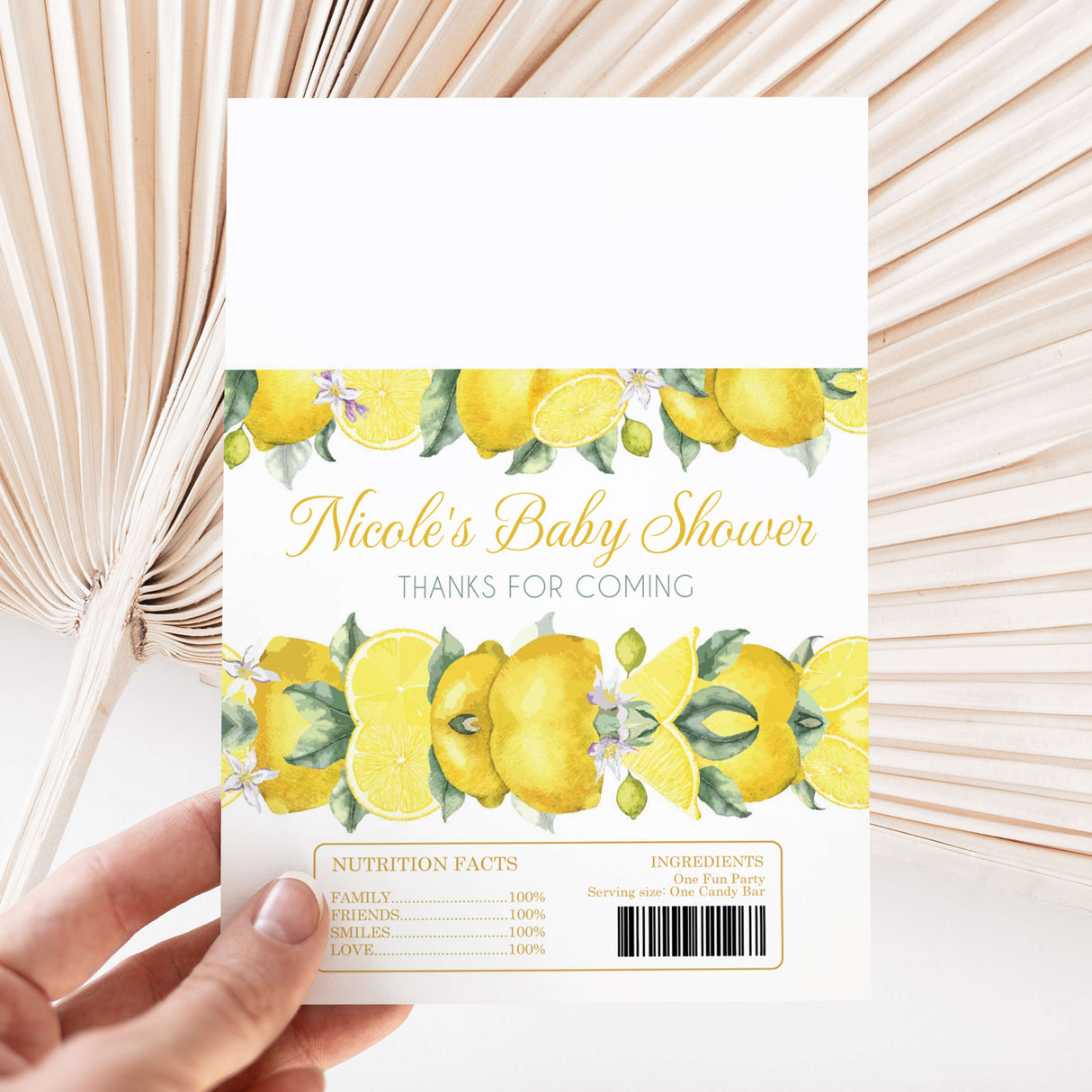Lemon-themed baby shower chocolate wrapper with yellow fruit print and Nicole’s Baby Shower text