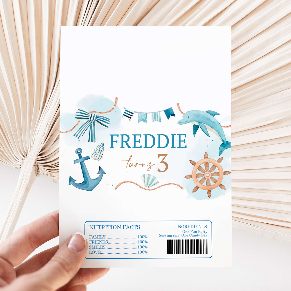 Nautical birthday chocolate wrapper sheet with dolphins, anchor, wheel, and name Freddie