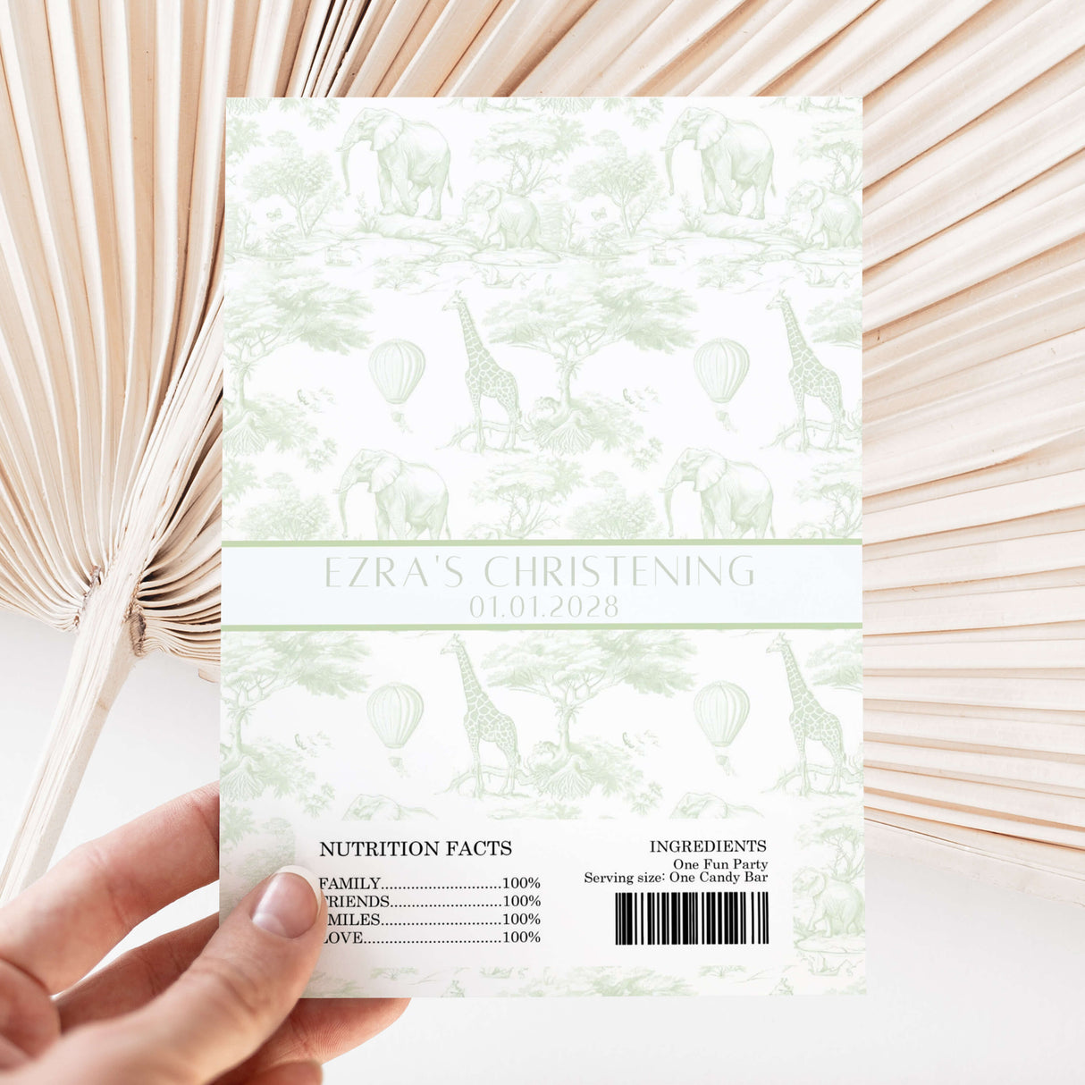 Green safari-themed chocolate wrapper sheet with elephant and giraffe print, christening text