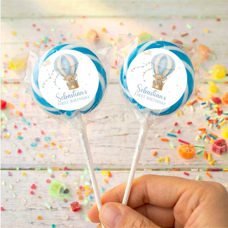 Personalised first-birthday lollipop, teddy hot air balloon on round label, blue border