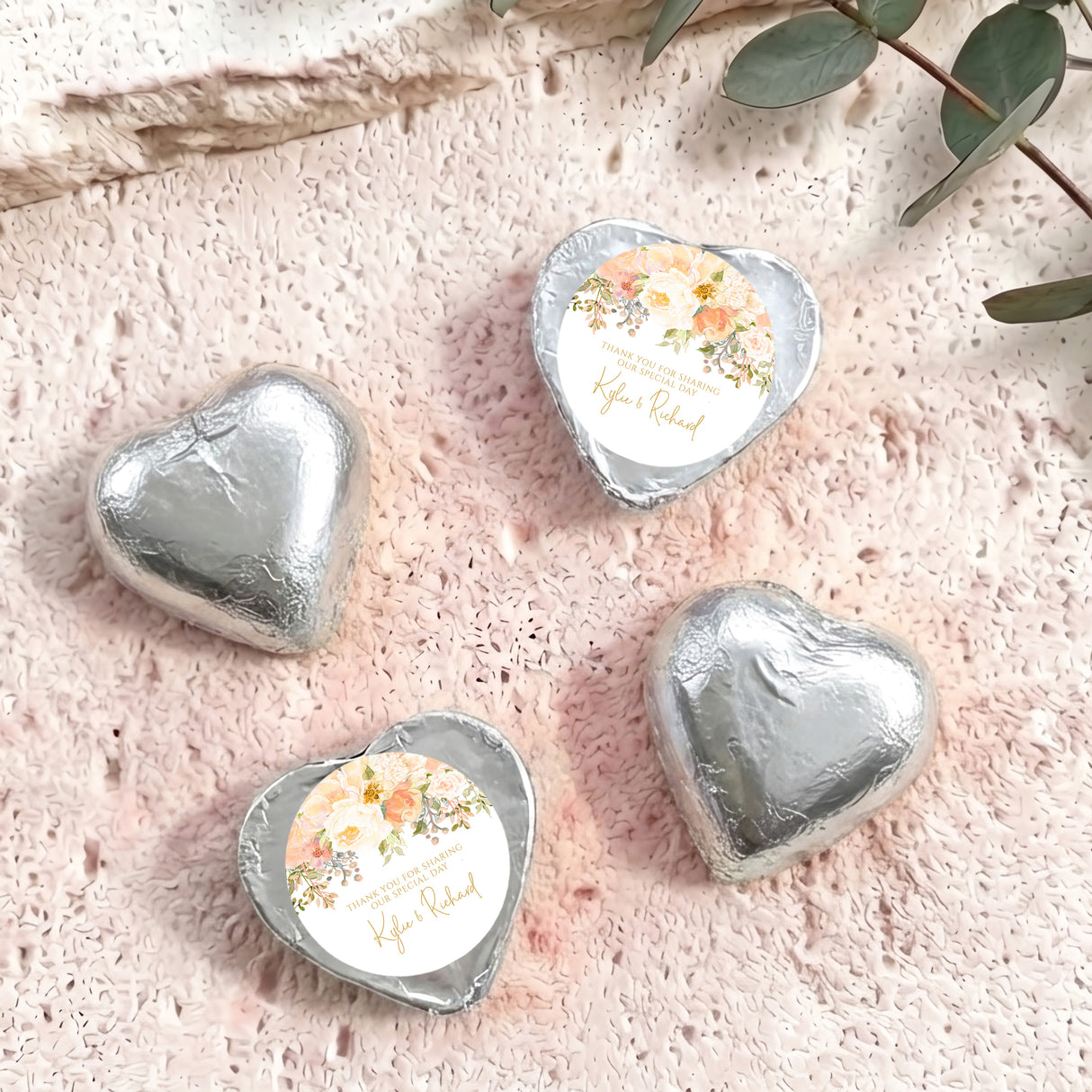 Silver foil-covered heart chocolates with floral personalized label, four pieces