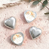 Silver foil-covered heart chocolates with floral personalized label, four pieces
