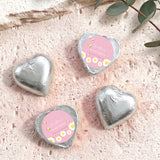 Silver foil heart chocolates with personalised baby-bee shower label on two hearts