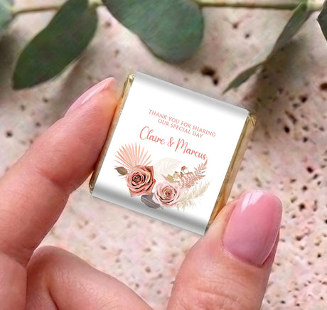 Hand holding pink floral boho mini chocolate wrapper with thank-you and name
