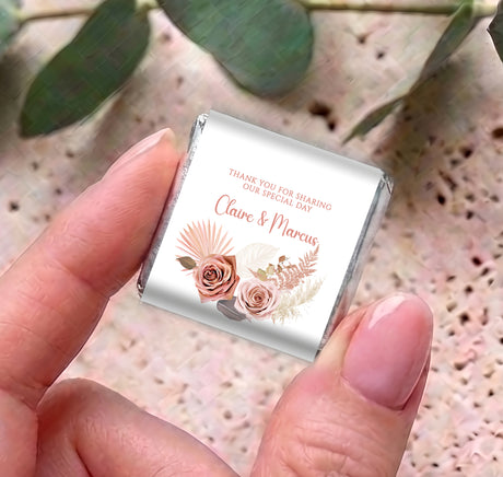 Close-up of pink floral boho mini chocolate wrapper with thank-you 'Claire & Marcus'