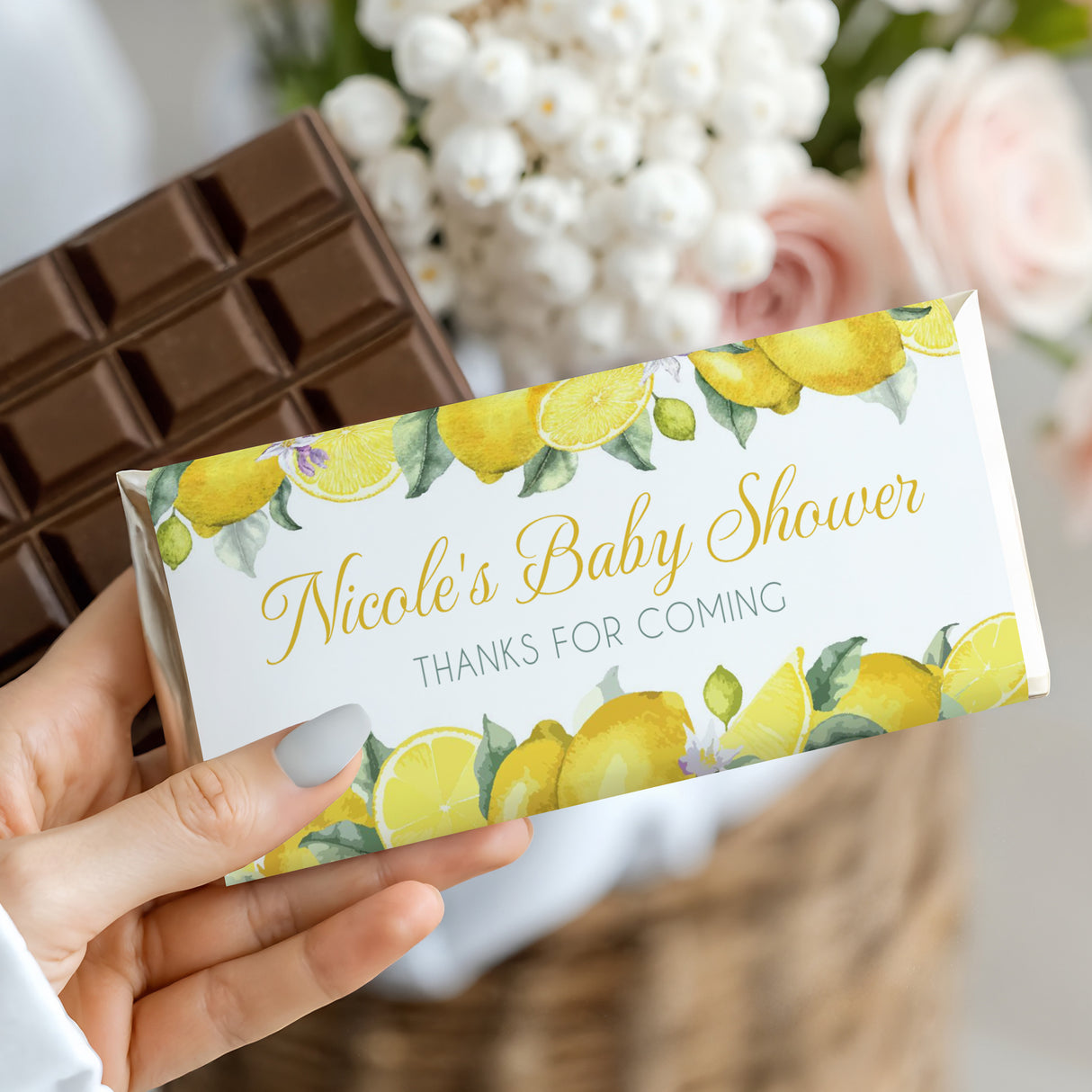 Personalised baby shower chocolate bar with lemon wrapper, “Nicole’s Baby Shower” text