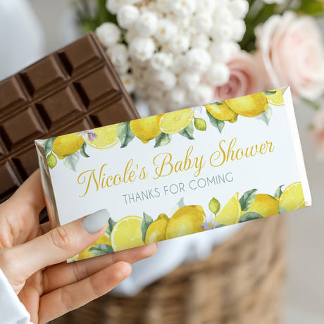 Personalised baby shower chocolate bar with lemon wrapper, “Nicole’s Baby Shower” text