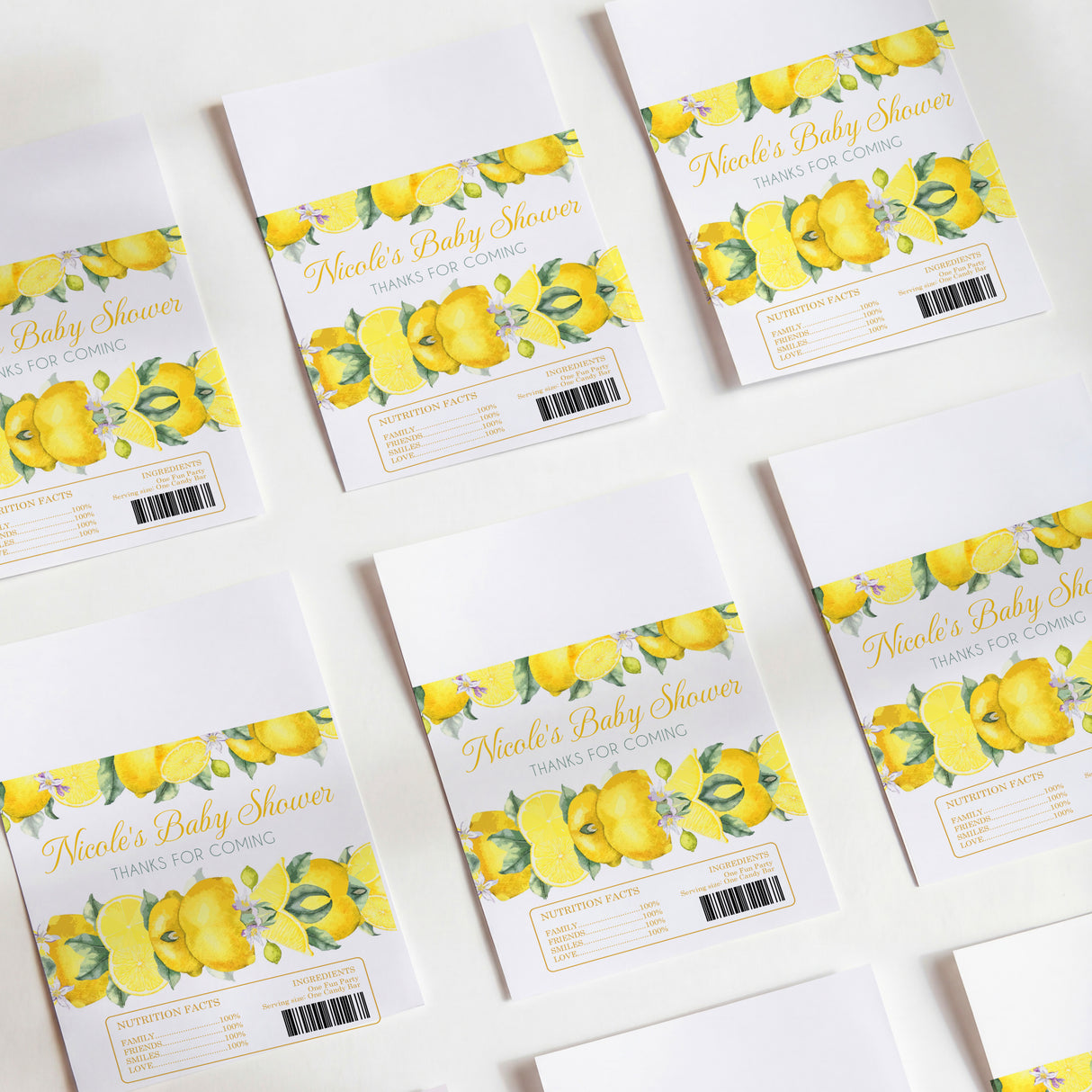 Lemon-printed baby shower chocolate wrappers with yellow fruit, green leaves, and thank-you text
