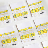 Lemon-printed baby shower chocolate wrappers with yellow fruit, green leaves, and thank-you text