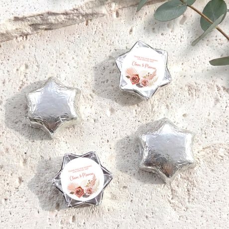 Silver star-shaped foil chocolate favours with personalised thank-you note