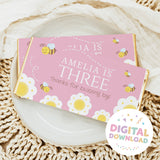 Pink bee themed chocolate bar wrapper with children text and bee icons